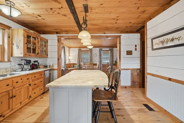 a room with lots of wooden furniture and shower