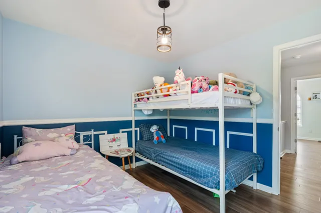 a bedroom with a bed and a desk