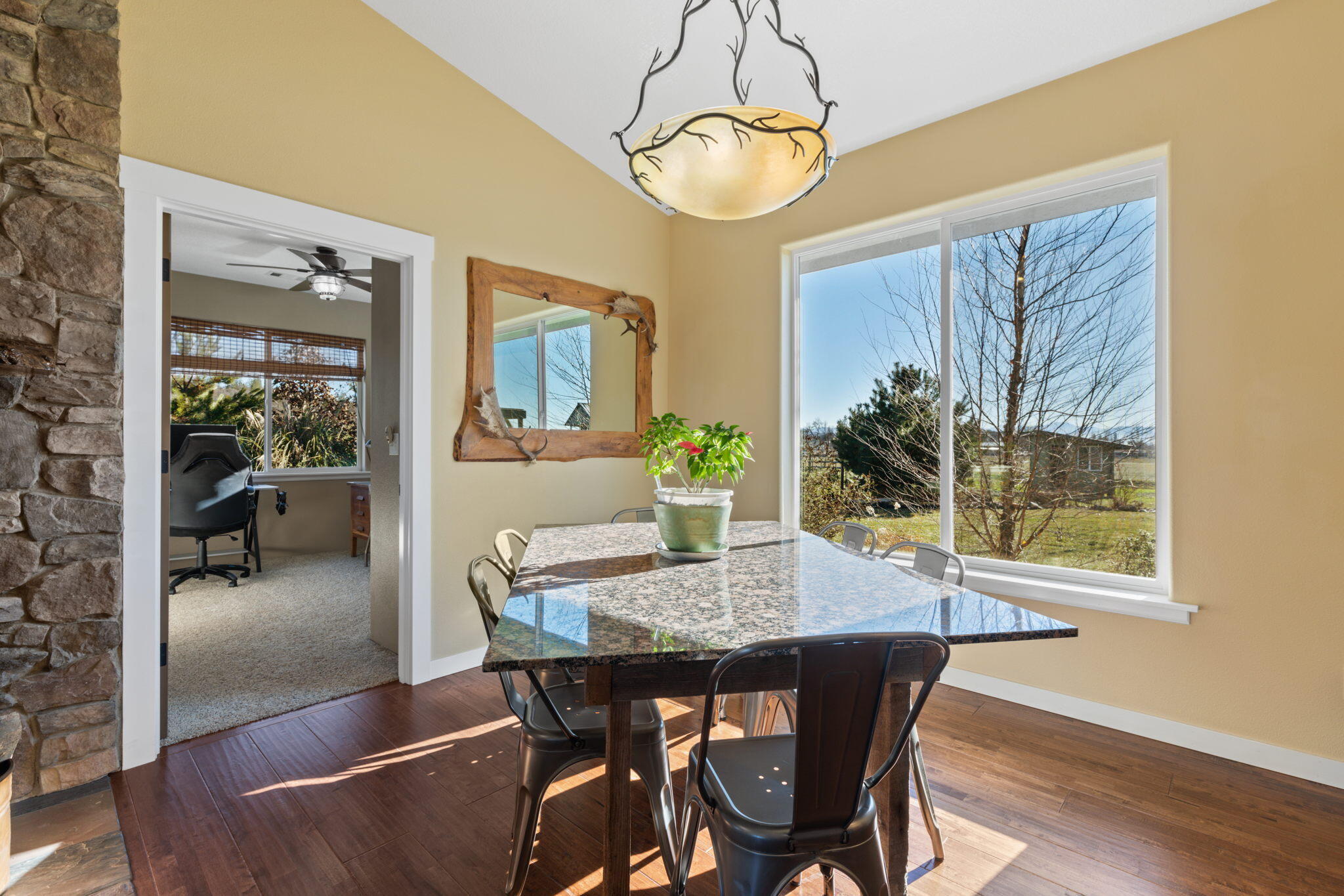3923 Beagle Road White City, OR 97503 - Photo 7 of 31 a dining room with furniture a chandelier and wooden floor
