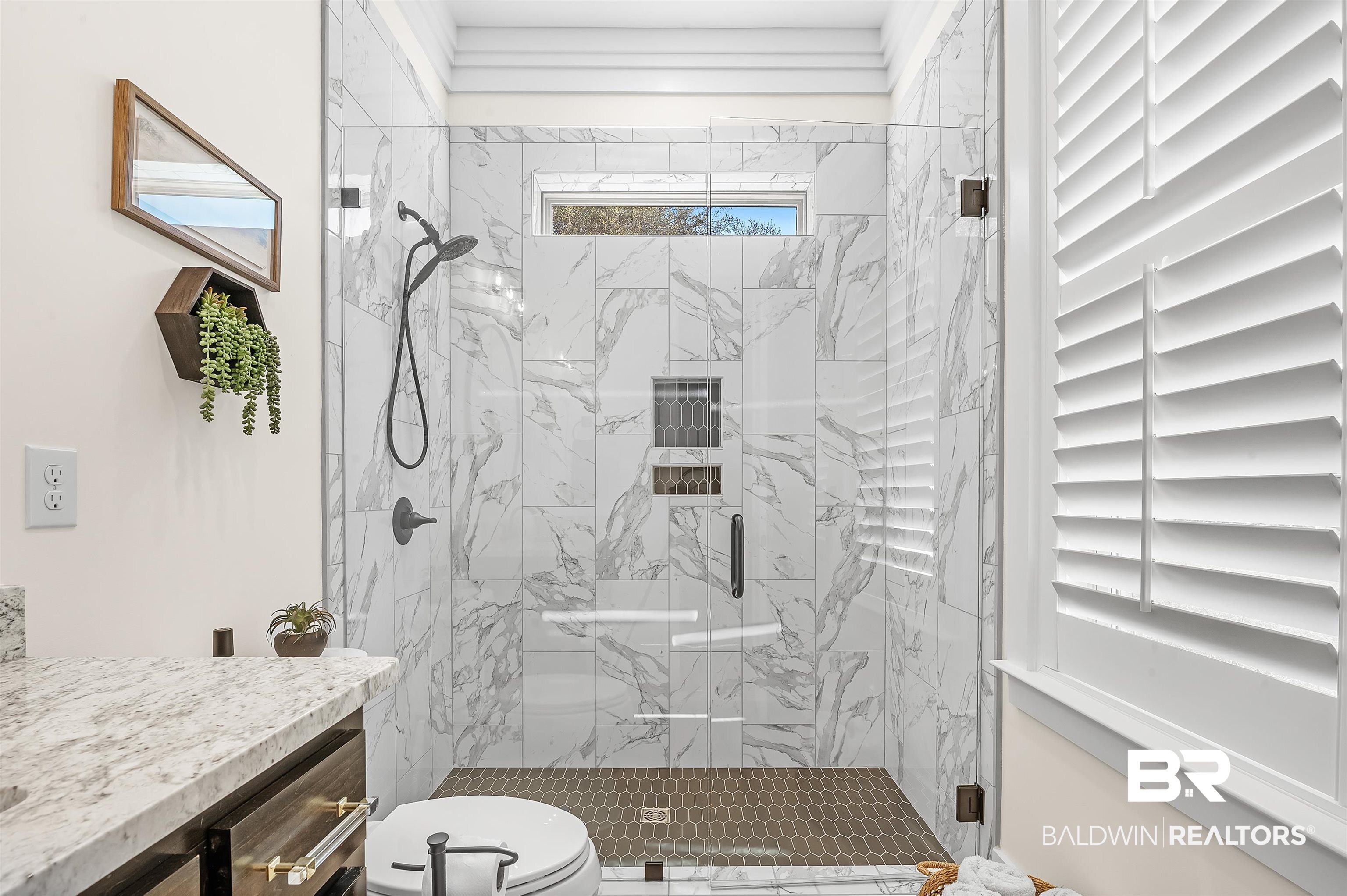 9144 Harvest Ridge Fairhope, AL 36532 - Photo 38 of 58 Bathroom with toilet, vanity, and a marble finish shower