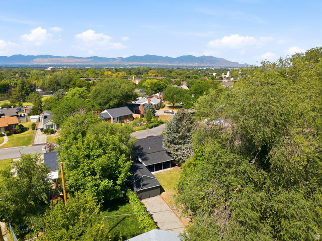 1187 East Ridgedale Circle Millcreek, UT 84106 - Photo 46 of 49 Expansive neighborhood showcasing mature trees and distant mountains under a clear sky