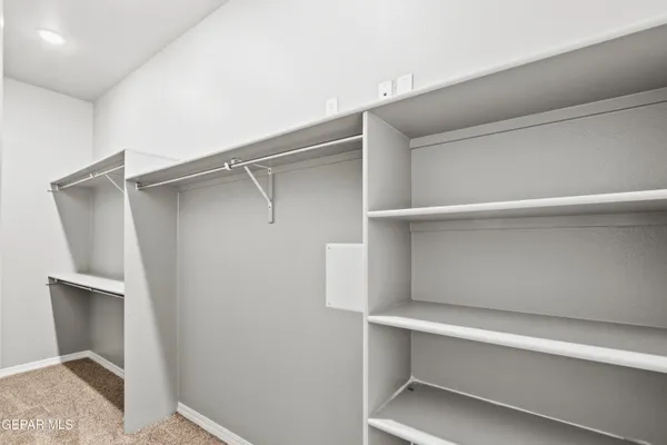 a view of an empty walk in closet