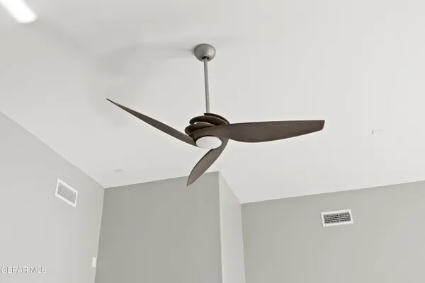 a close view of light fixtures and staircase