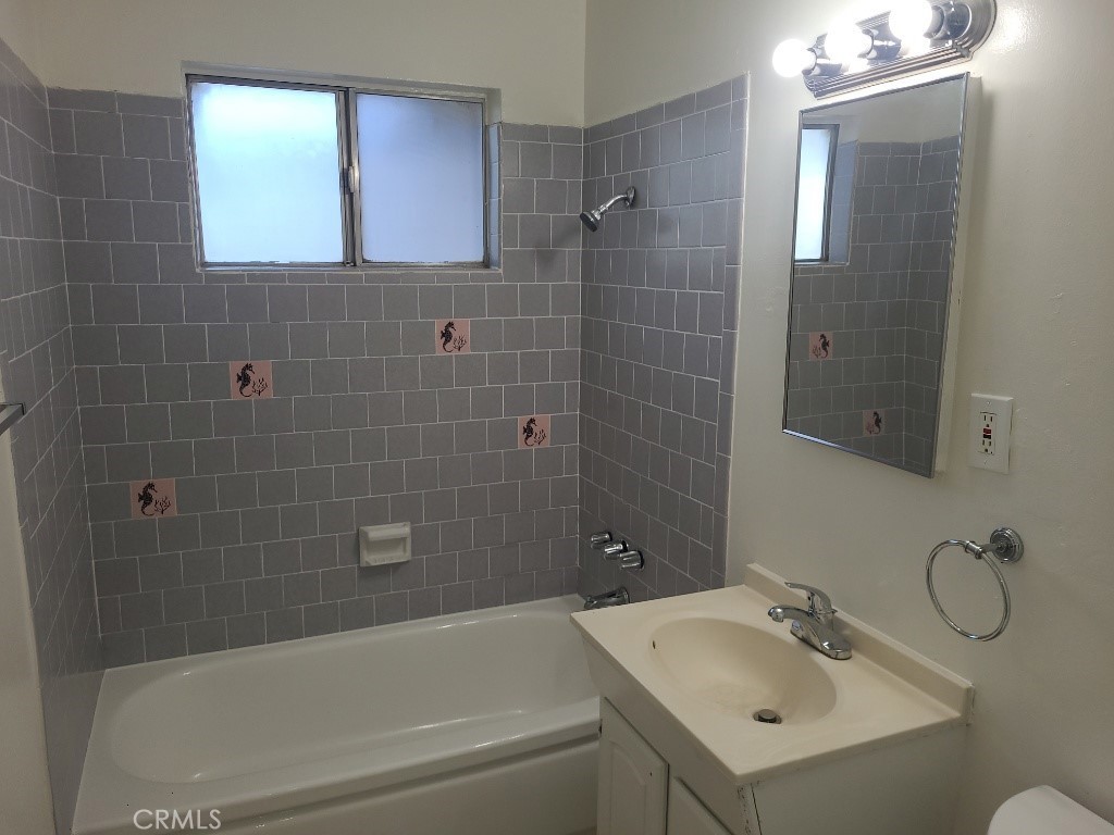 6262 Jones Riverside, CA 92505 - Photo 5 of 6 a bathroom with a sink vanity tub and shower