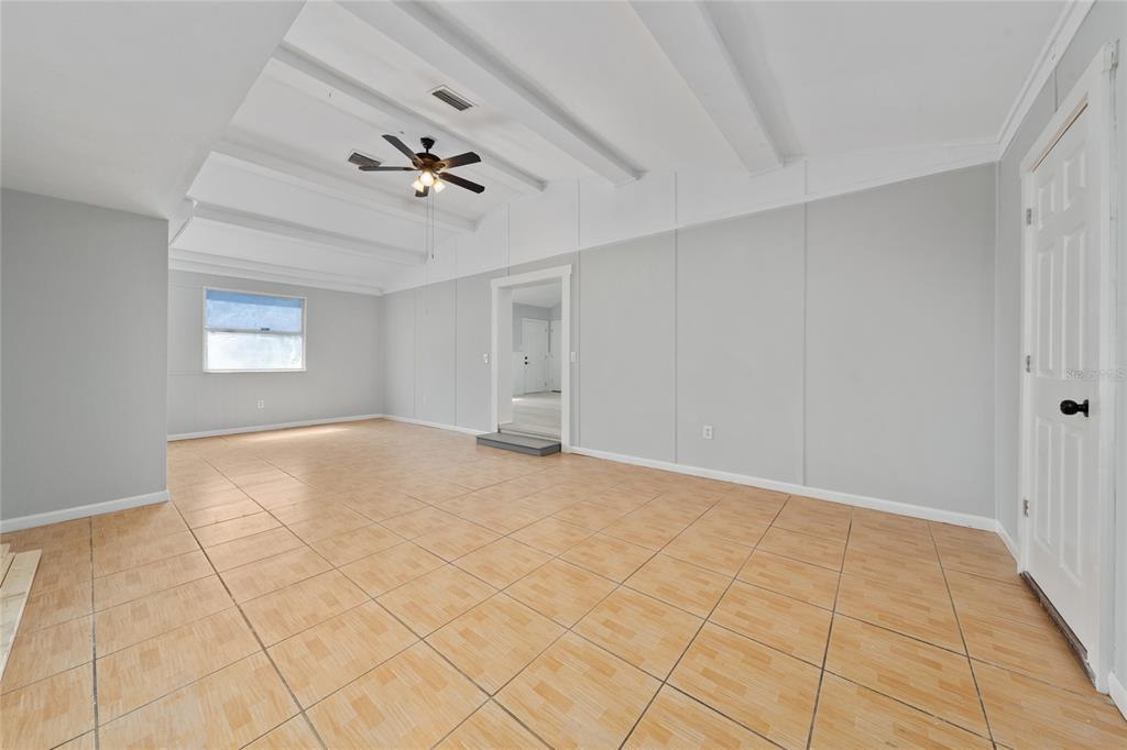 1034 Falcon Street Deltona, FL 32725 - Photo 25 of 36 a view of empty room with window and ceiling fan