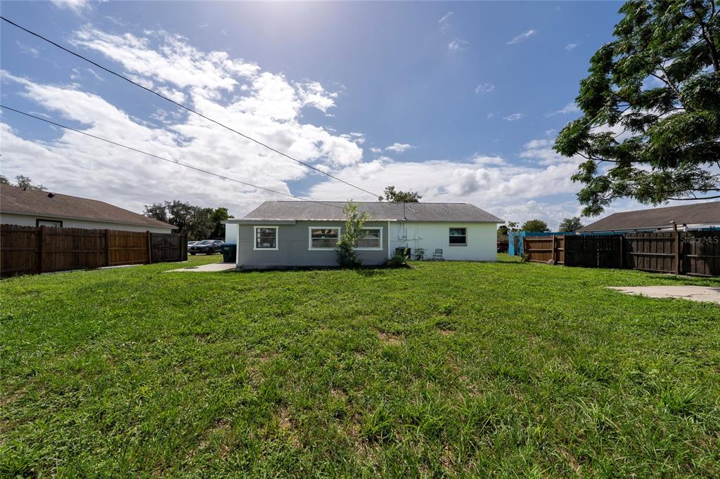 1034 Falcon Street Deltona, FL 32725 - Photo 32 of 36 a front view of a house with a garden