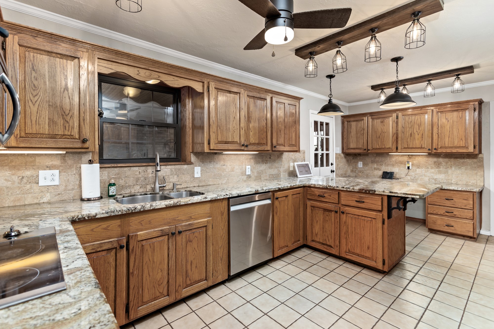 1747 Farm To Market Road 365 Nome, TX 77629 - Photo 10 of 24 a kitchen with stainless steel appliances granite countertop a sink and cabinets