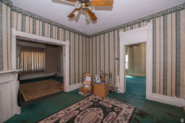 1256 24th Street Ogden, UT 84401 - Photo 8 of 34 Interior room featuring patterned wallpaper and green carpeting