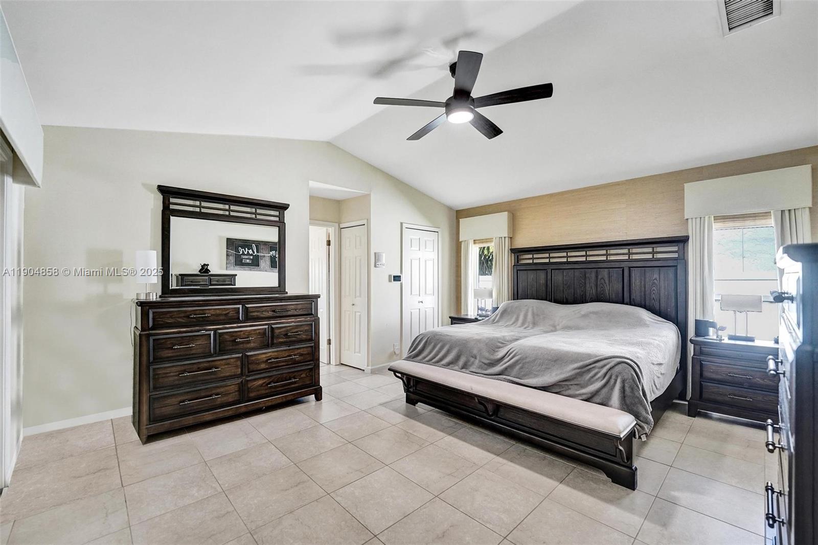 1501 Northwest 99th Avenue Plantation, FL 33322 - Photo 18 of 45 a bedroom with a bed and ceiling fan