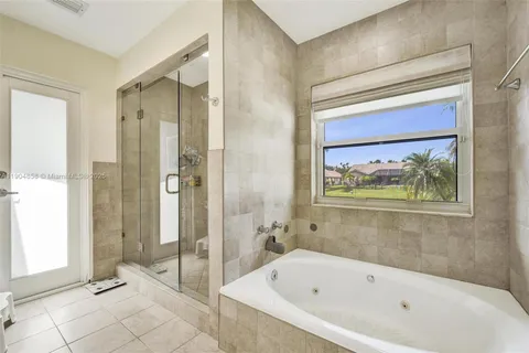 a bathroom with a bathtub and shower