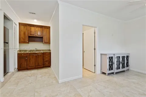 a view of kitchen with stainless steel appliances cabinets and a counter top space