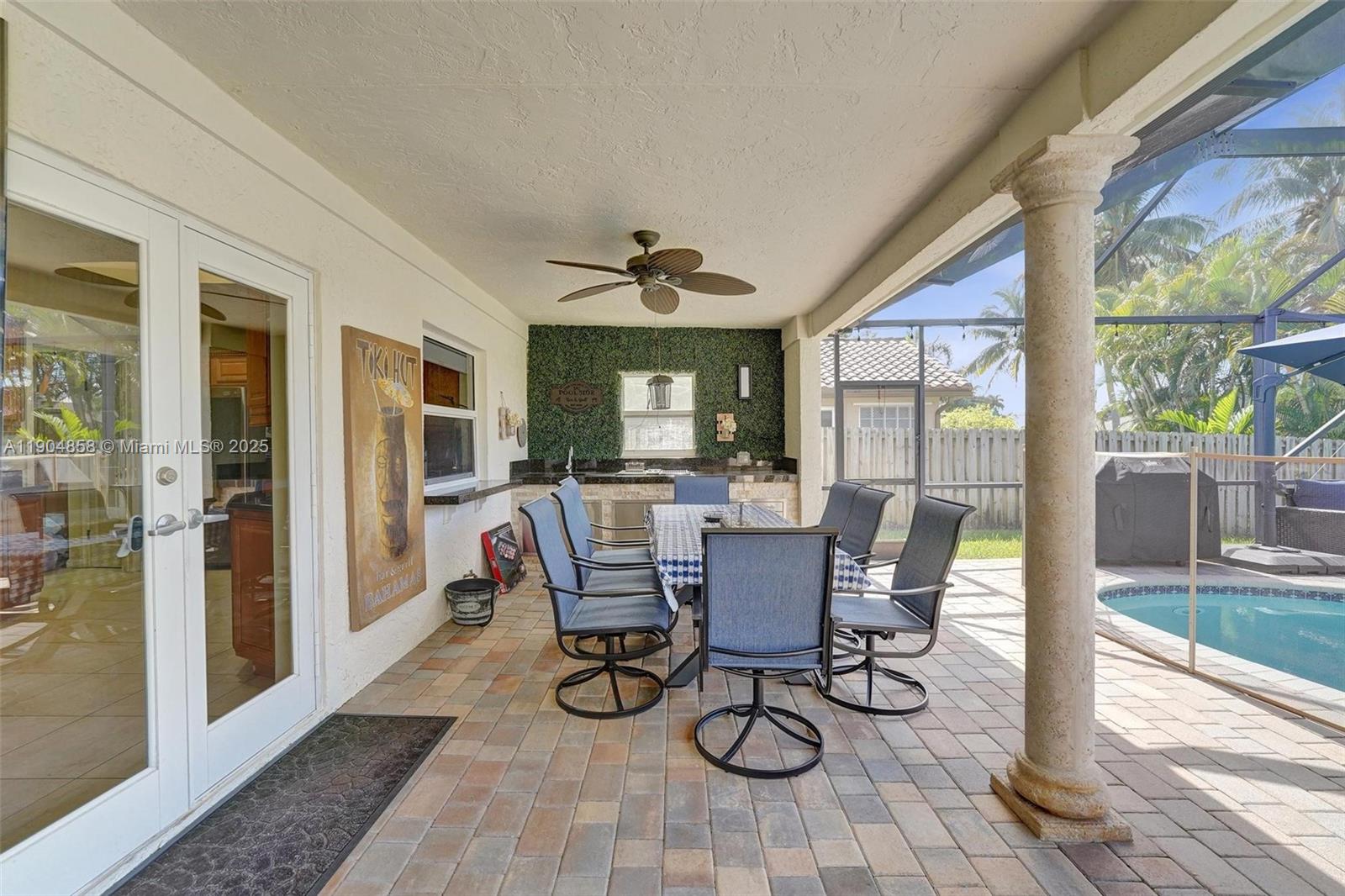 1501 Northwest 99th Avenue Plantation, FL 33322 - Photo 32 of 45 a view of a dining room with furniture wooden floor and a rug