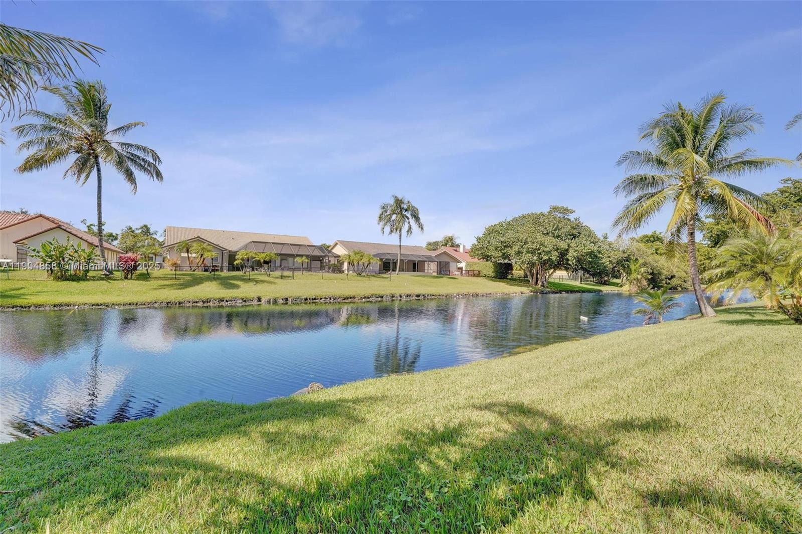 1501 Northwest 99th Avenue Plantation, FL 33322 - Photo 40 of 45 a view of a lake with a house