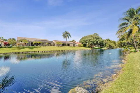 a view of a lake with houses in the back