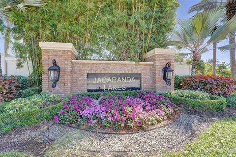 a sign that is in front of flowers