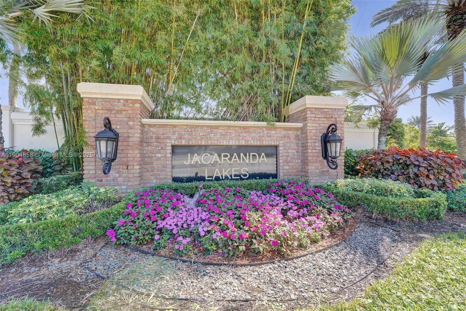 1501 Northwest 99th Avenue Plantation, FL 33322 - Photo 43 of 45 a sign that is in front of flowers