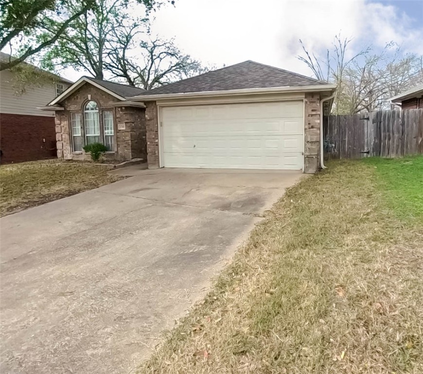 1710 Ibis Court Bryan, TX 77807 - Photo 4 of 6 front view of a house with a yard