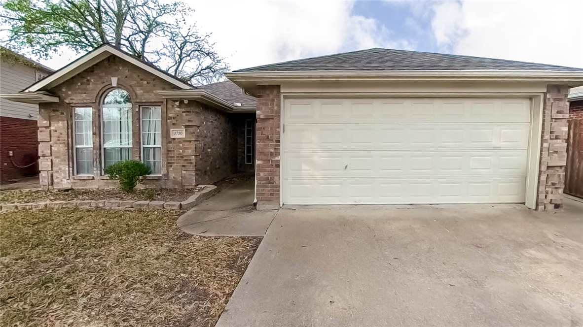 1710 Ibis Court Bryan, TX 77807 - Photo 6 of 6 a front view of a house with garden