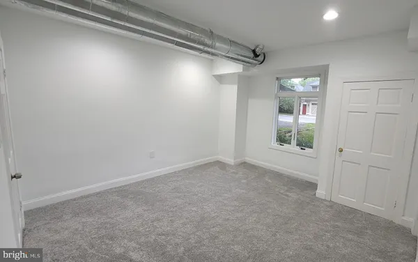 a view of gallery with wooden floor