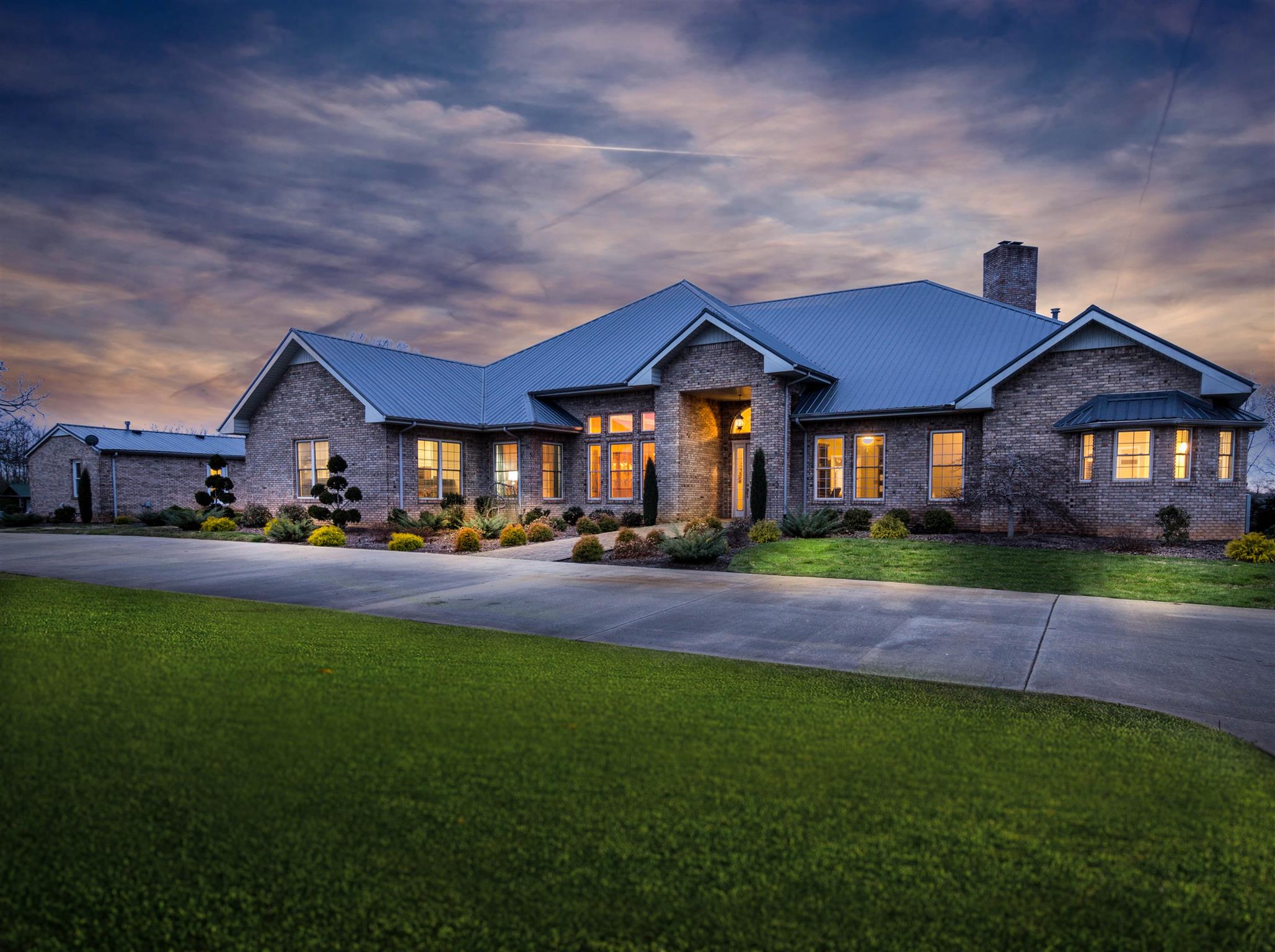 555 Randall Hitchcock Road Rock Island, TN 38581 - Photo 1 of 28 a front view of a house with a garden and yard