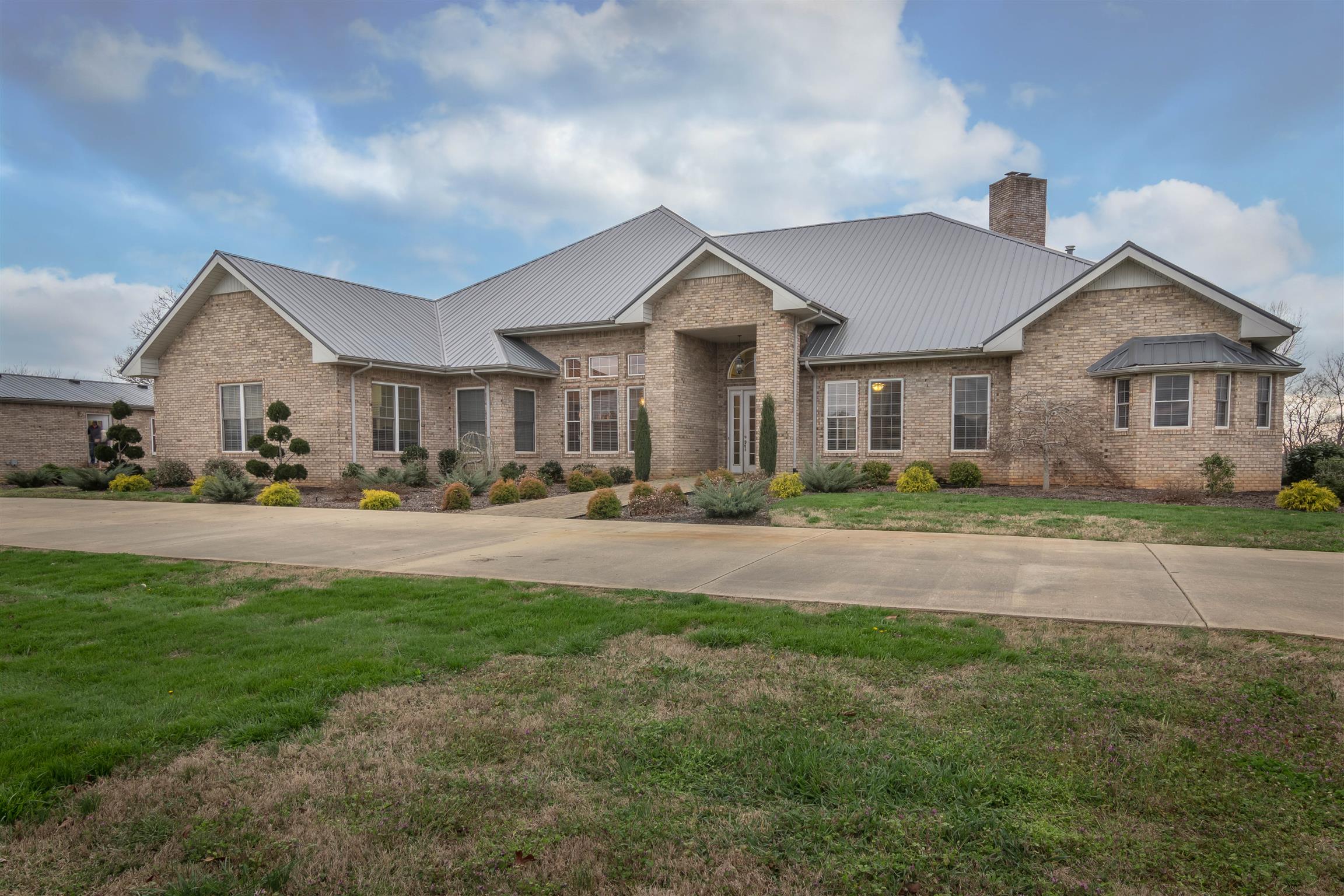 555 Randall Hitchcock Road Rock Island, TN 38581 - Photo 2 of 28 a front view of a house with a yard and trees