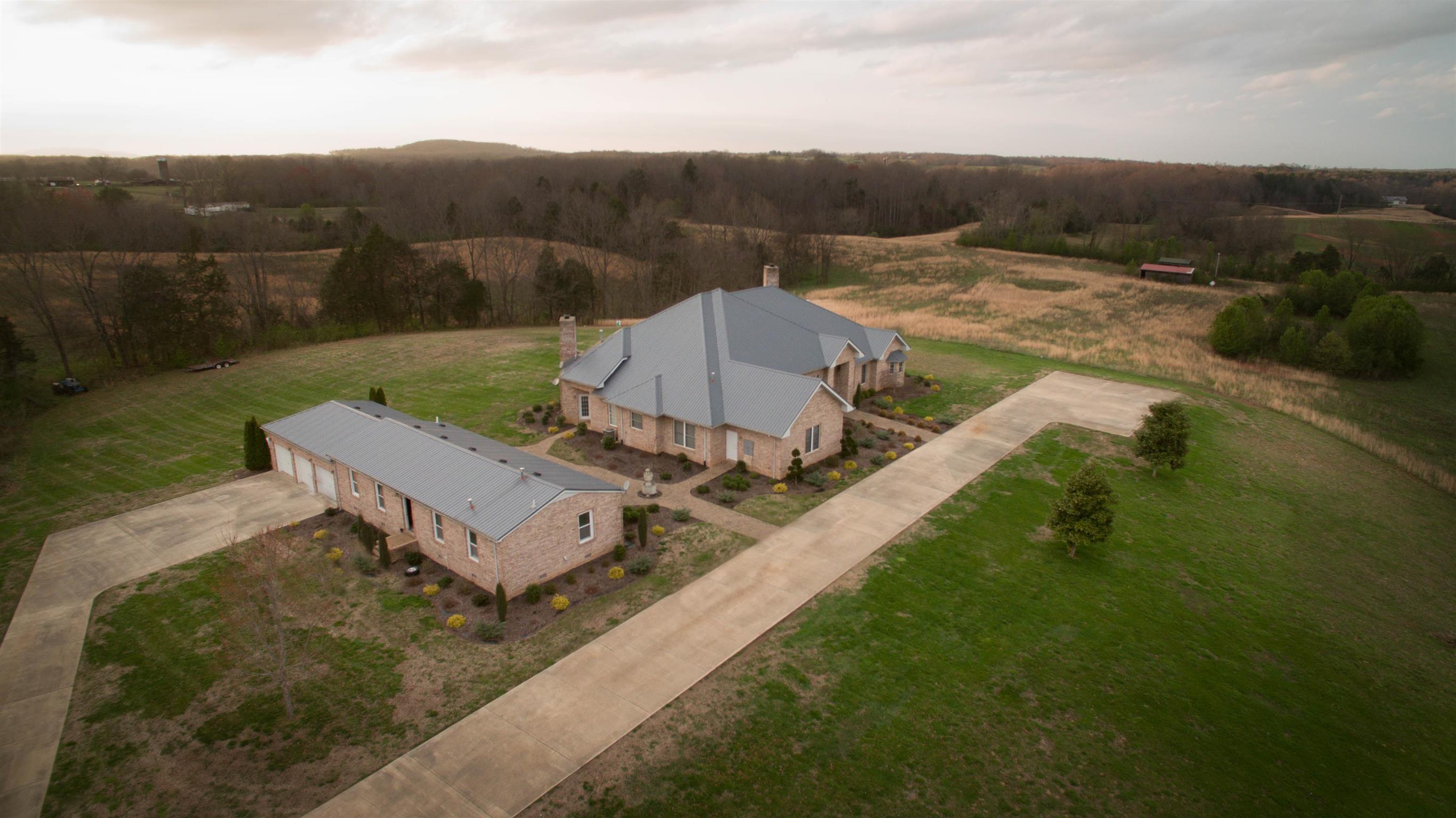 555 Randall Hitchcock Road Rock Island, TN 38581 - Photo 25 of 28 a view of a house in a big yard with wooden fence