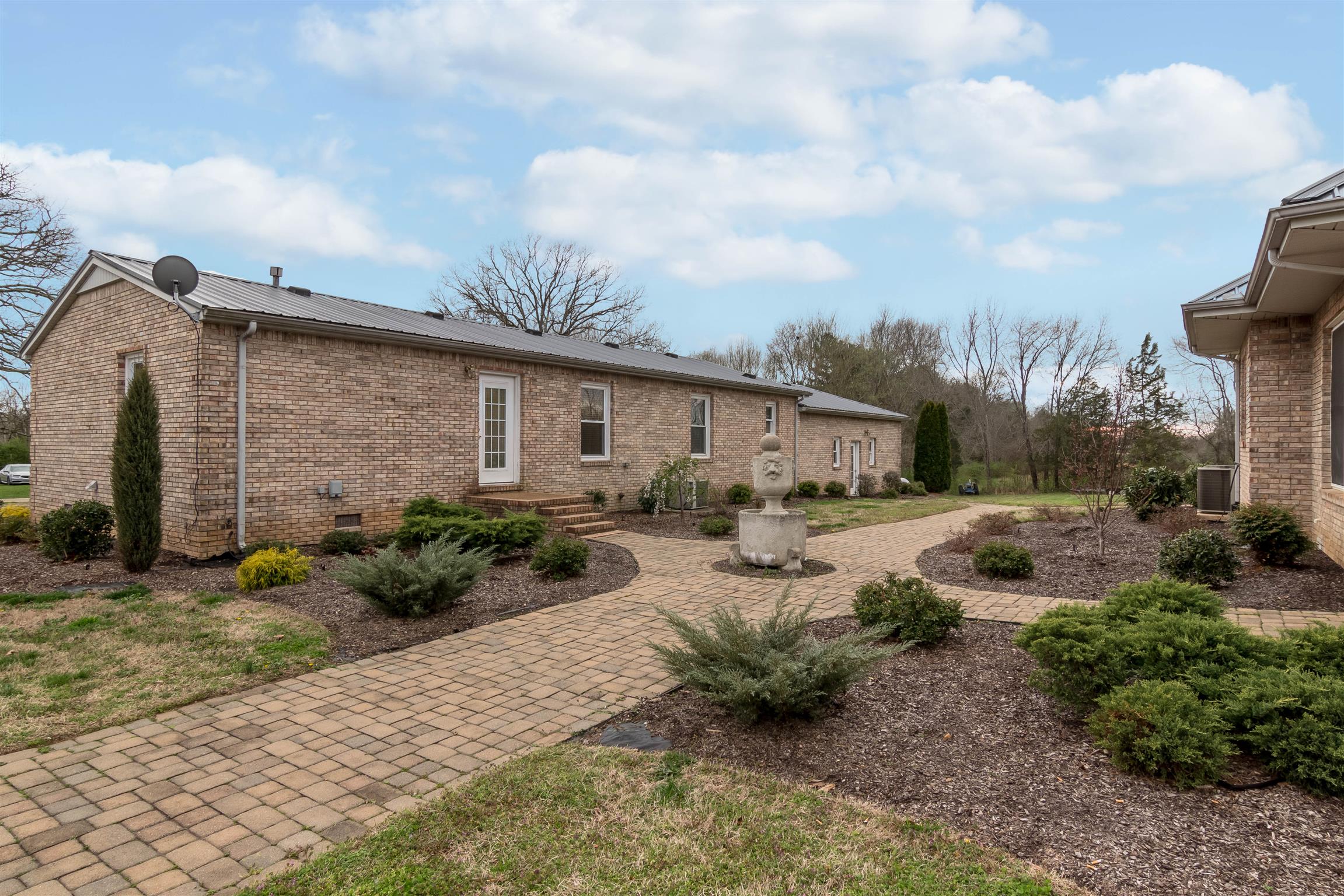 555 Randall Hitchcock Road Rock Island, TN 38581 - Photo 3 of 28 a front view of a house with garden