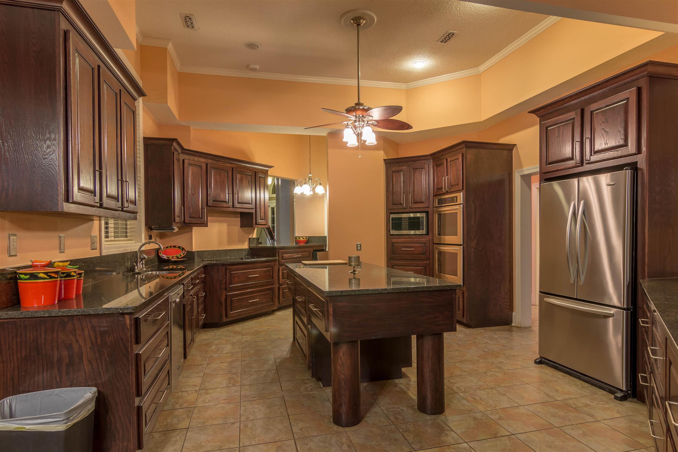 555 Randall Hitchcock Road Rock Island, TN 38581 - Photo 8 of 28 a kitchen with refrigerator cabinets and wooden floor