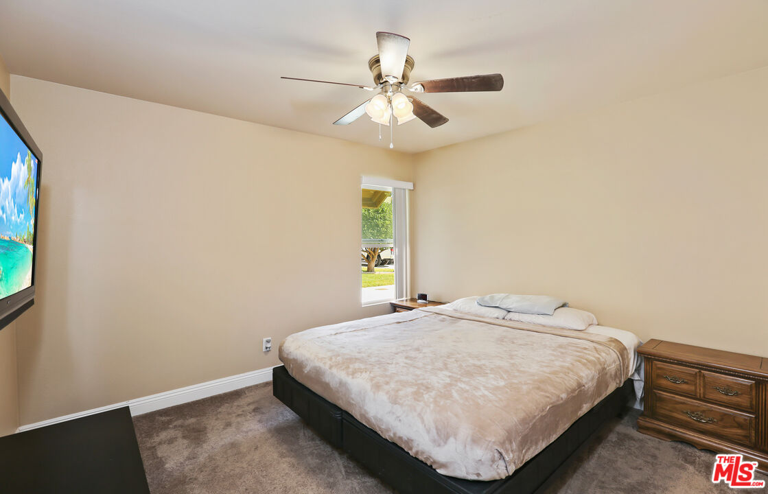 9225 Flax Place Riverside, CA 92503 - Photo 19 of 35 a bedroom with a bed and a window