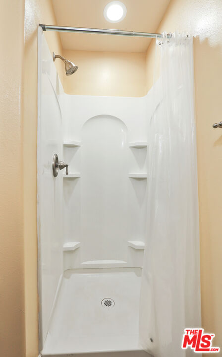 9225 Flax Place Riverside, CA 92503 - Photo 23 of 35 a bathroom with a shower and a shower