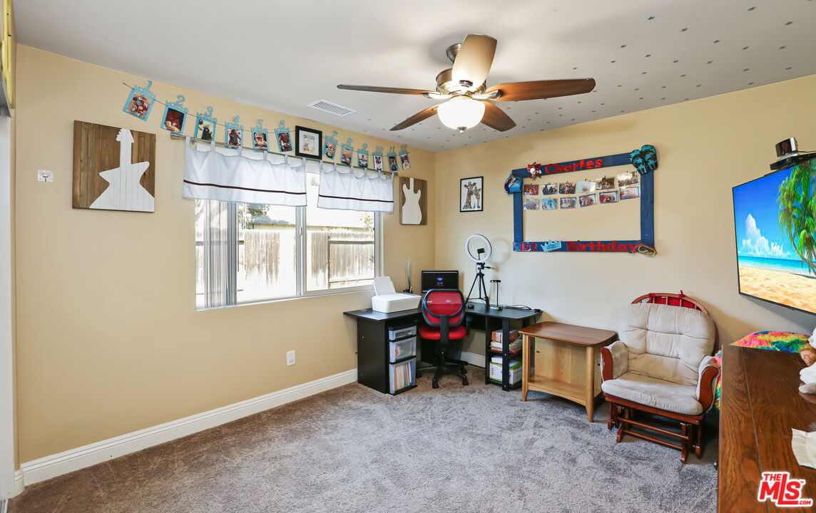 9225 Flax Place Riverside, CA 92503 - Photo 24 of 35 a living room with furniture and a window