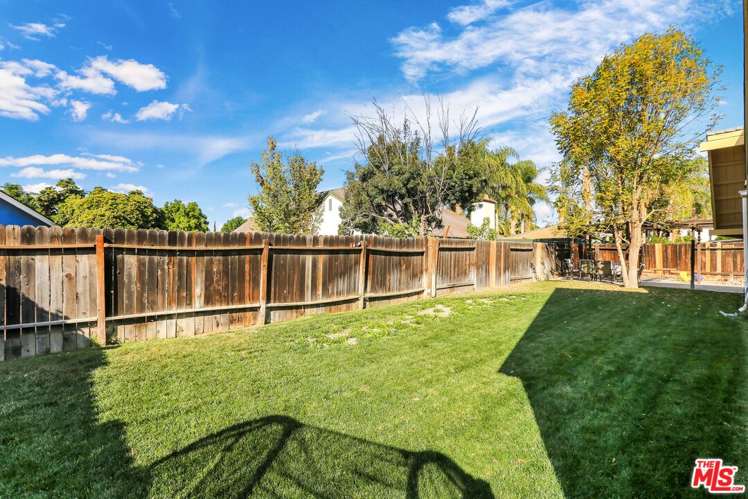 9225 Flax Place Riverside, CA 92503 - Photo 26 of 35 a view of a backyard with a garden and plants