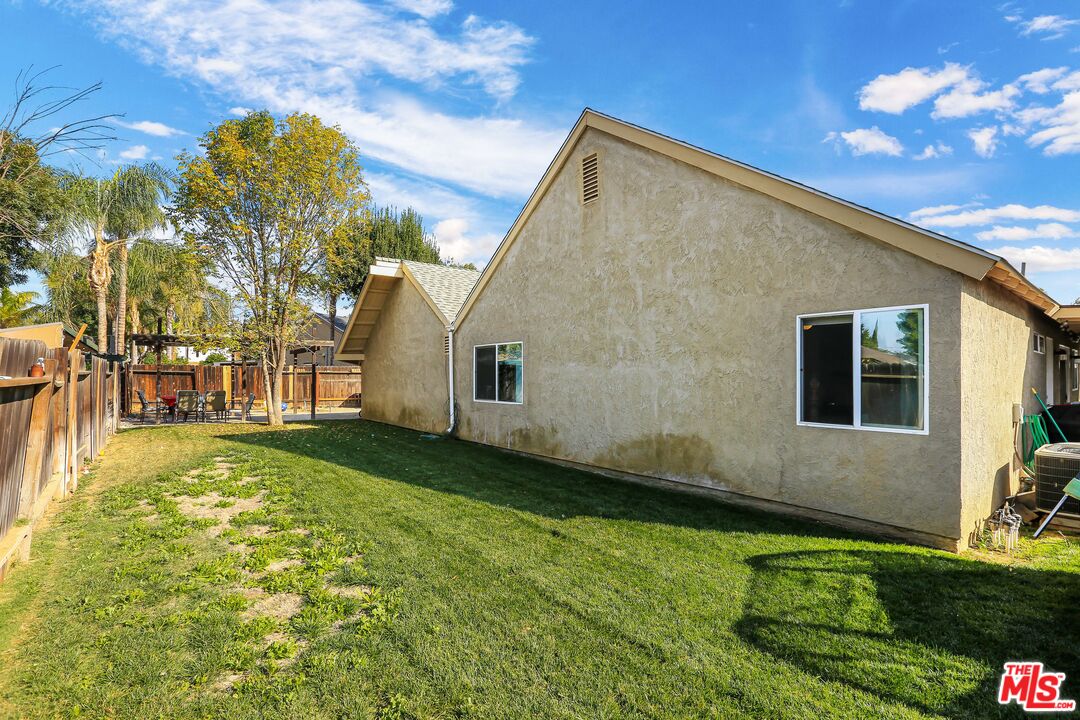 9225 Flax Place Riverside, CA 92503 - Photo 28 of 35 a backyard of a house with lots of green space