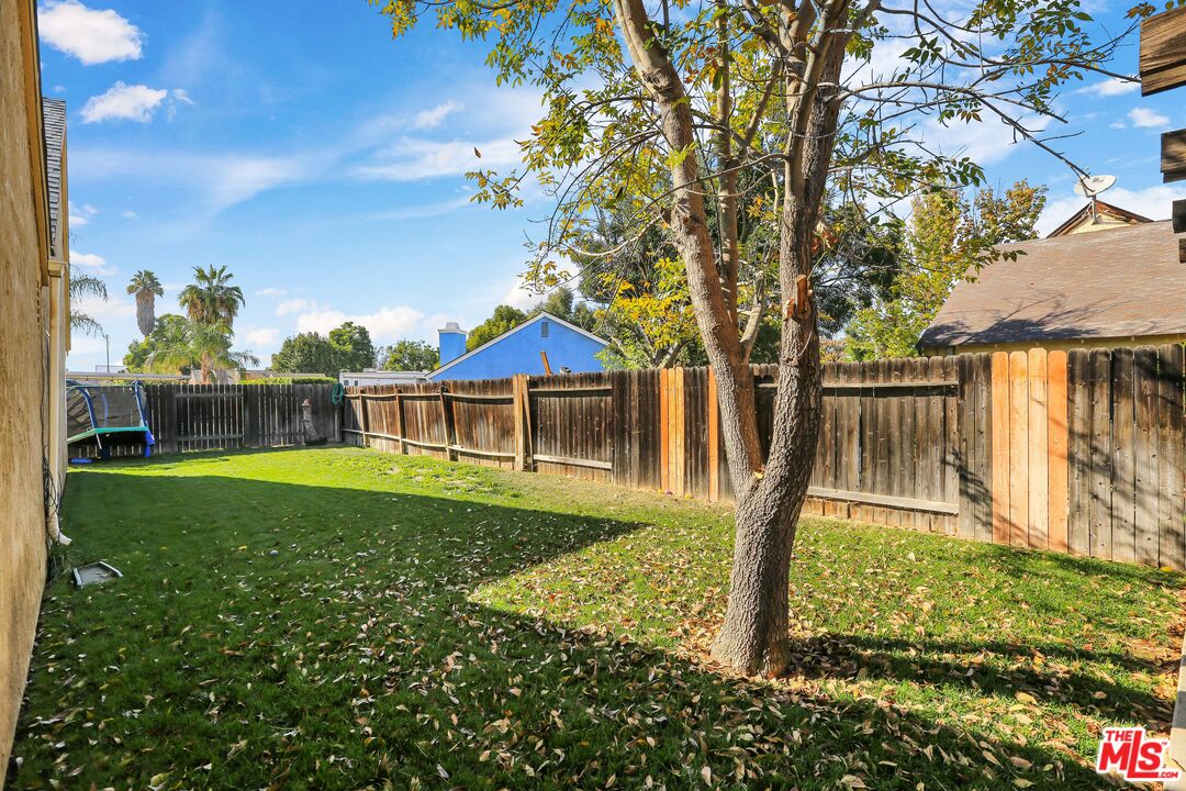 9225 Flax Place Riverside, CA 92503 - Photo 30 of 35 a front view of a house with garden