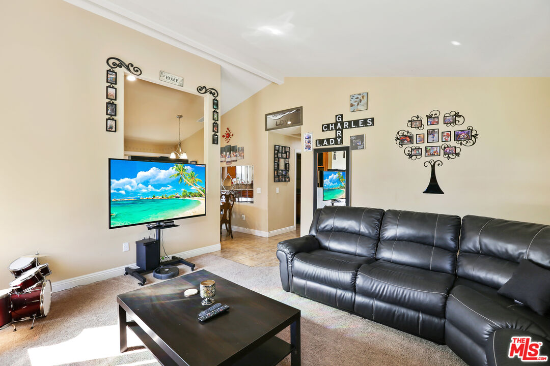 9225 Flax Place Riverside, CA 92503 - Photo 6 of 35 a living room with furniture and a flat screen tv