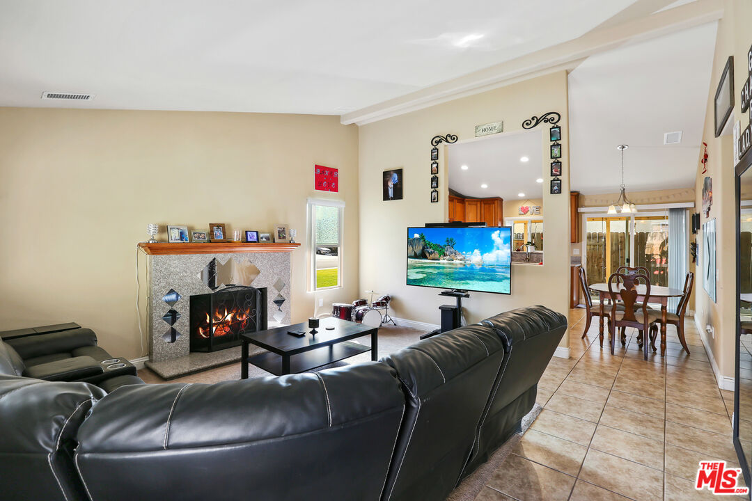 9225 Flax Place Riverside, CA 92503 - Photo 7 of 35 a living room with furniture and a fireplace
