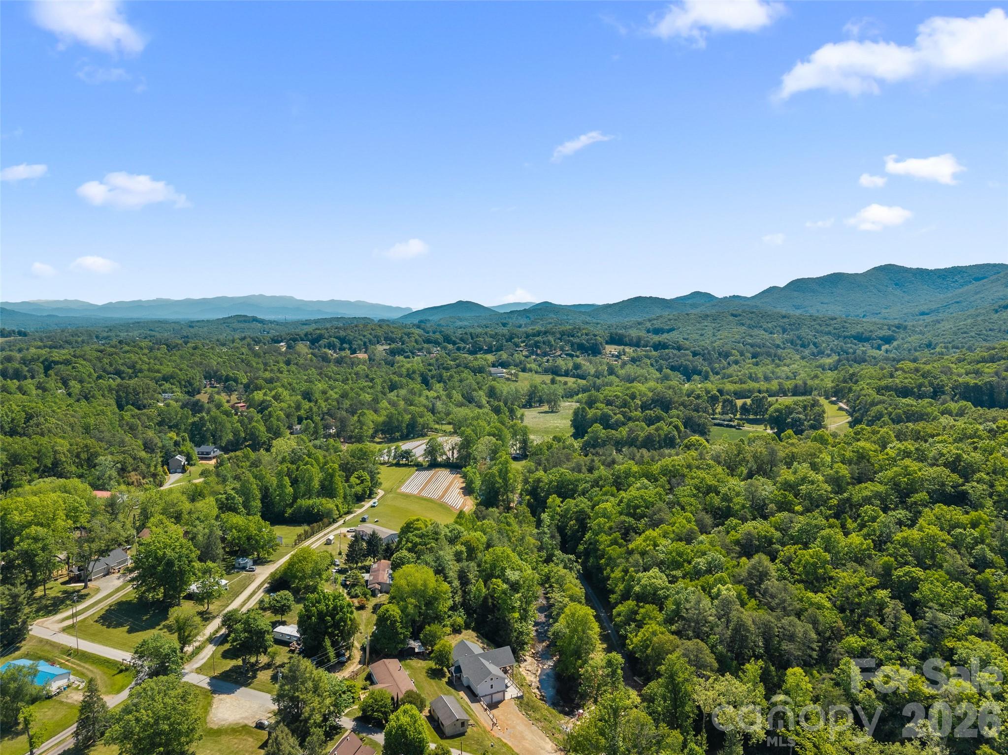 123 Israel Road Candler, NC 28715 - Photo 43 of 44 a view of a city with lush green forest