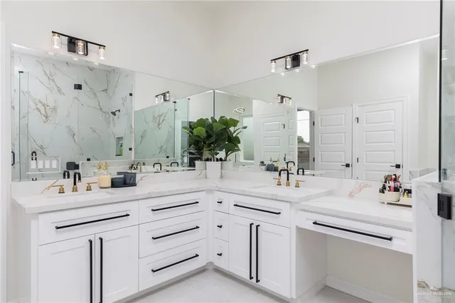 a bathroom with double vanity sink a mirror and a