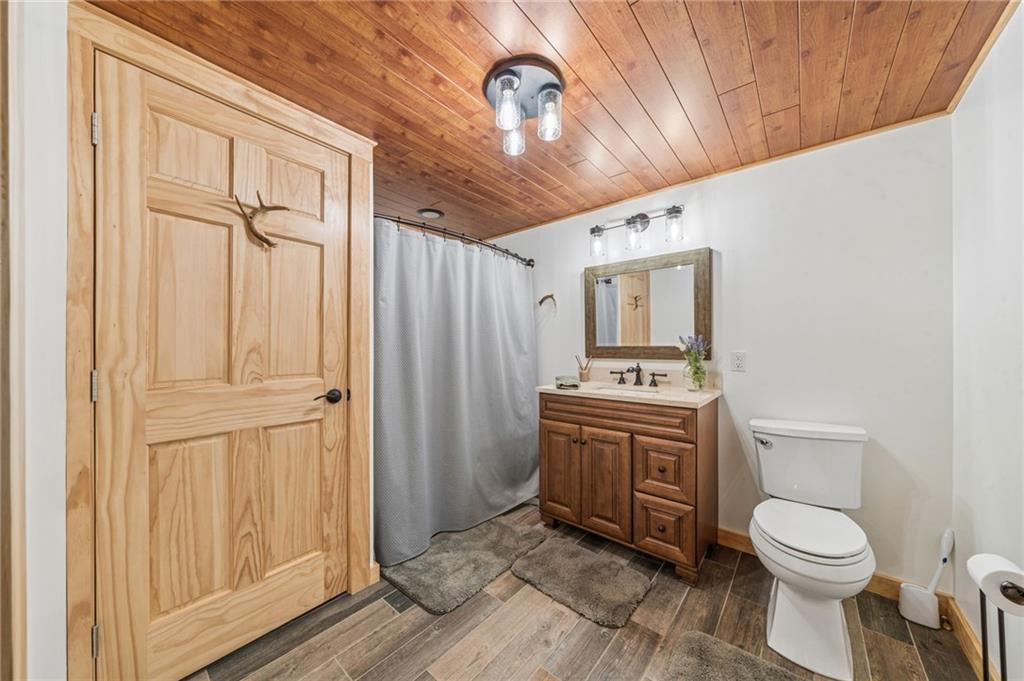 905 Indian Creek Valley Road Normalville, PA 15469 - Photo 25 of 38 a bathroom with a sink a toilet and shower