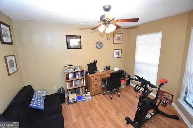 a bed room with a bed and a desk