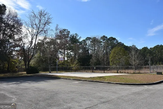 a view of a swimming pool with a yard