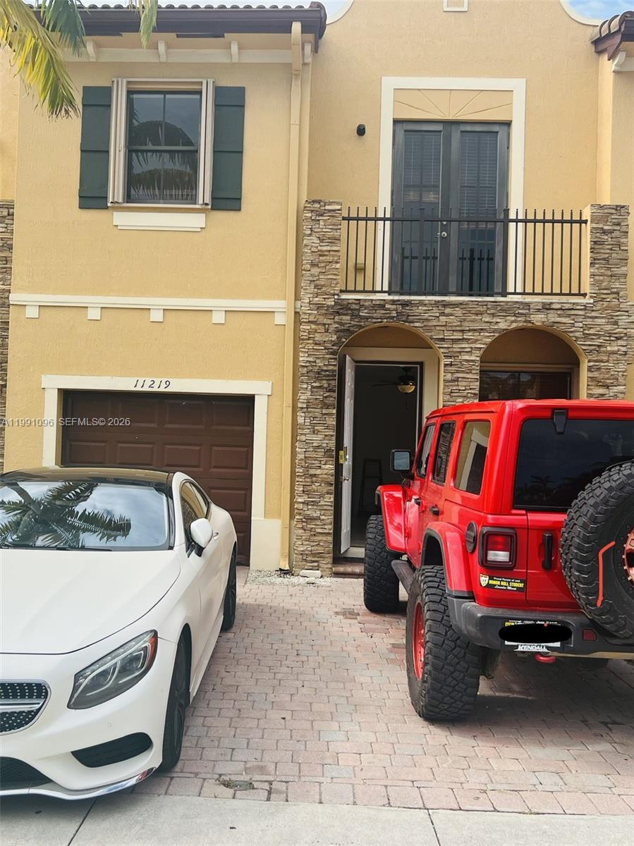 a front view of a house with outdoor space