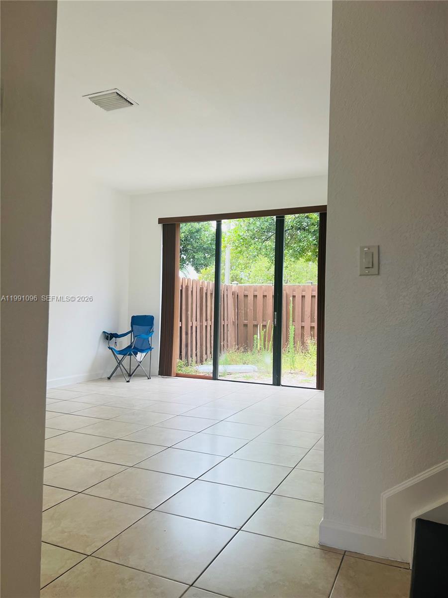 11219 Southwest 234 Terrace, Unit 11219 Homestead, FL 33032 - Photo 3 of 16 a view of a room with a large window
