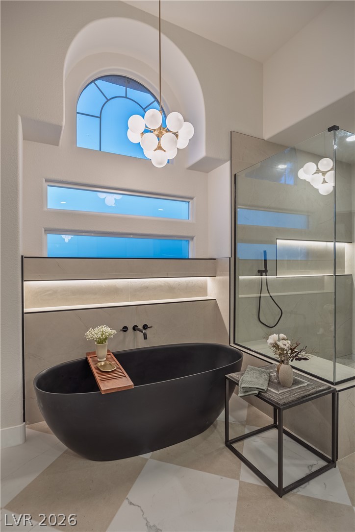 8800 Lusso Las Vegas, NV 89134 - Photo 47 of 85 Full bathroom with a freestanding tub, walk in shower, and suspended lighting