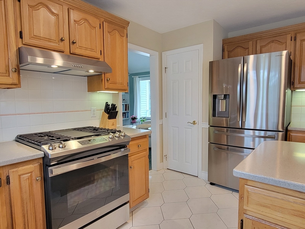 11 Femia Road Ashland, MA 01721 - Photo 11 of 42 a kitchen with stainless steel appliances granite countertop a stove a refrigerator and a refrigerator