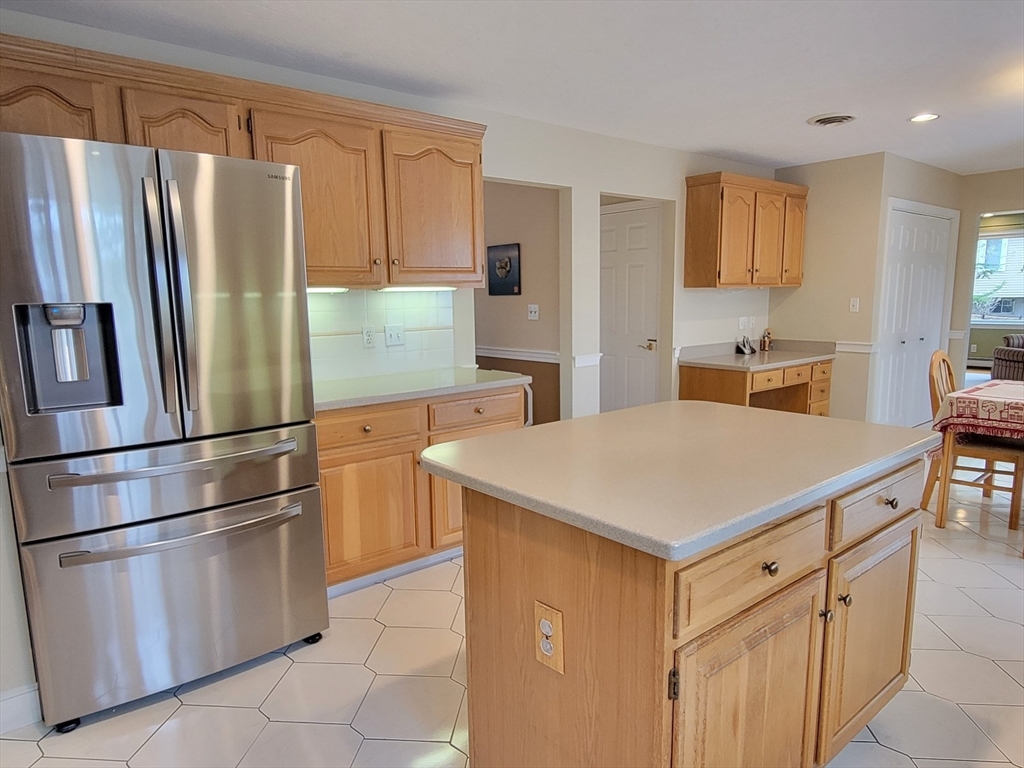 11 Femia Road Ashland, MA 01721 - Photo 12 of 42 a kitchen with stainless steel appliances a refrigerator sink and cabinets