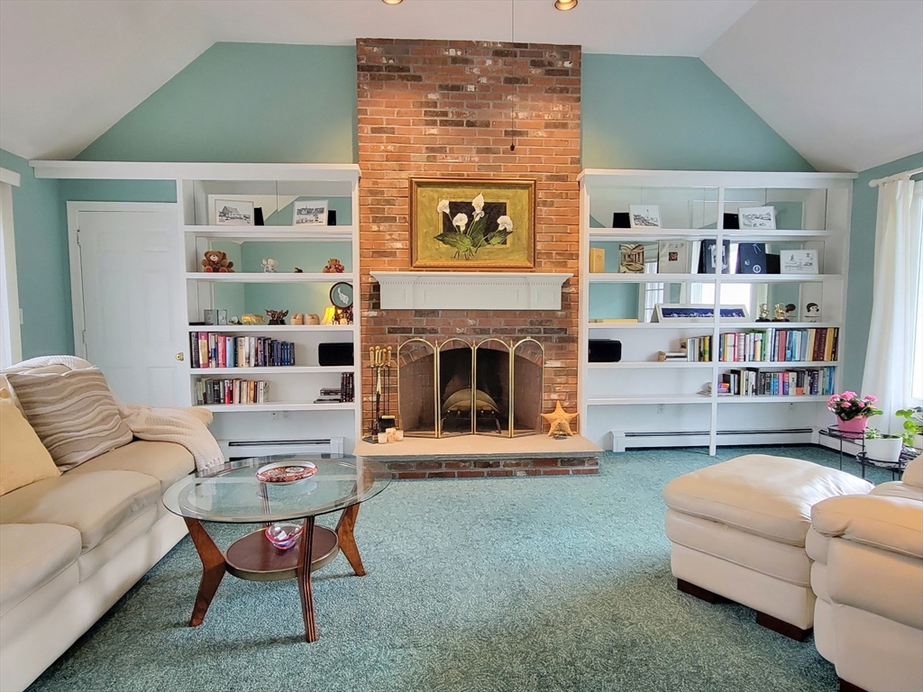 11 Femia Road Ashland, MA 01721 - Photo 16 of 42 a living room with furniture and a fireplace