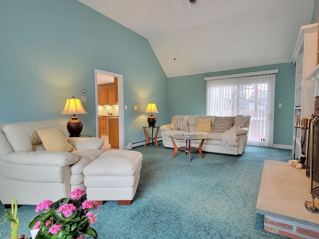 11 Femia Road Ashland, MA 01721 - Photo 17 of 42 a living room with furniture and a chandelier