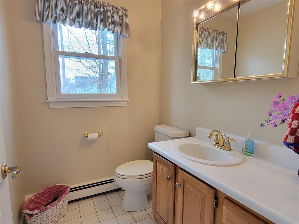 11 Femia Road Ashland, MA 01721 - Photo 20 of 42 a bathroom with a sink toilet and a window