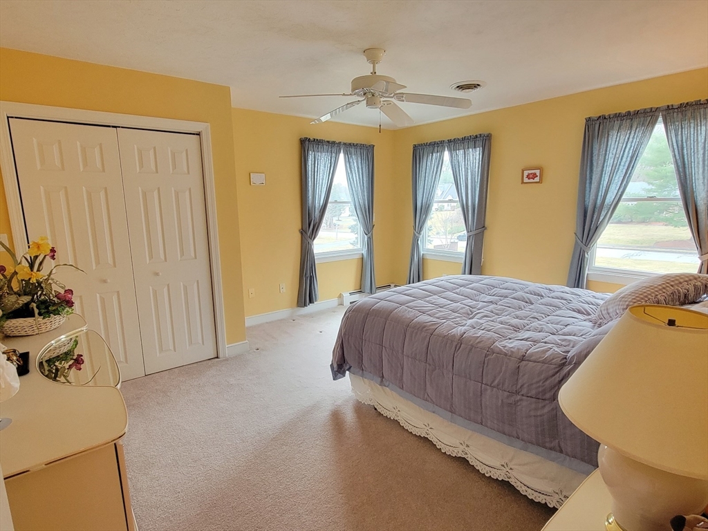 11 Femia Road Ashland, MA 01721 - Photo 31 of 42 a spacious bedroom with a bed and a window